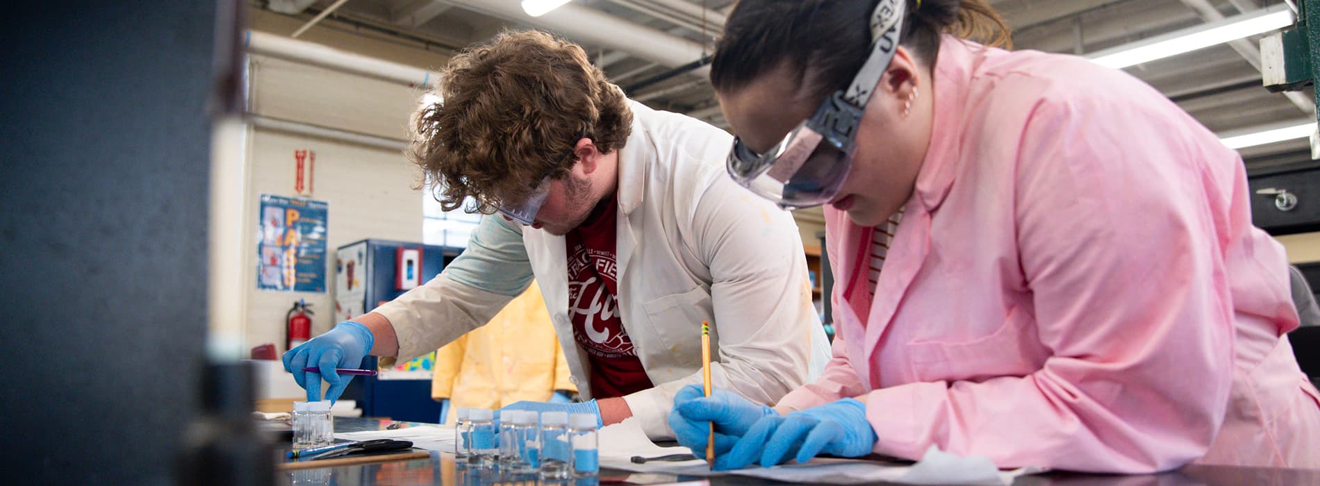 students performing research in the chem lab