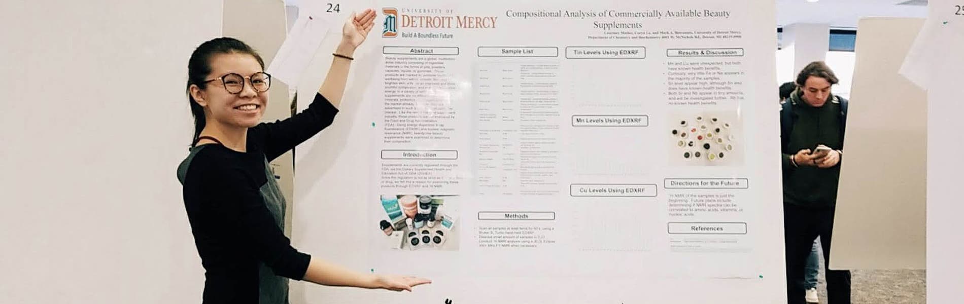 Detroit Mercy Student Coryn Le presenting research