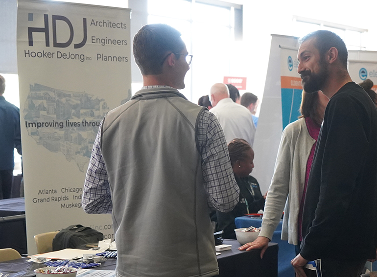 student and employer talking at career fair 