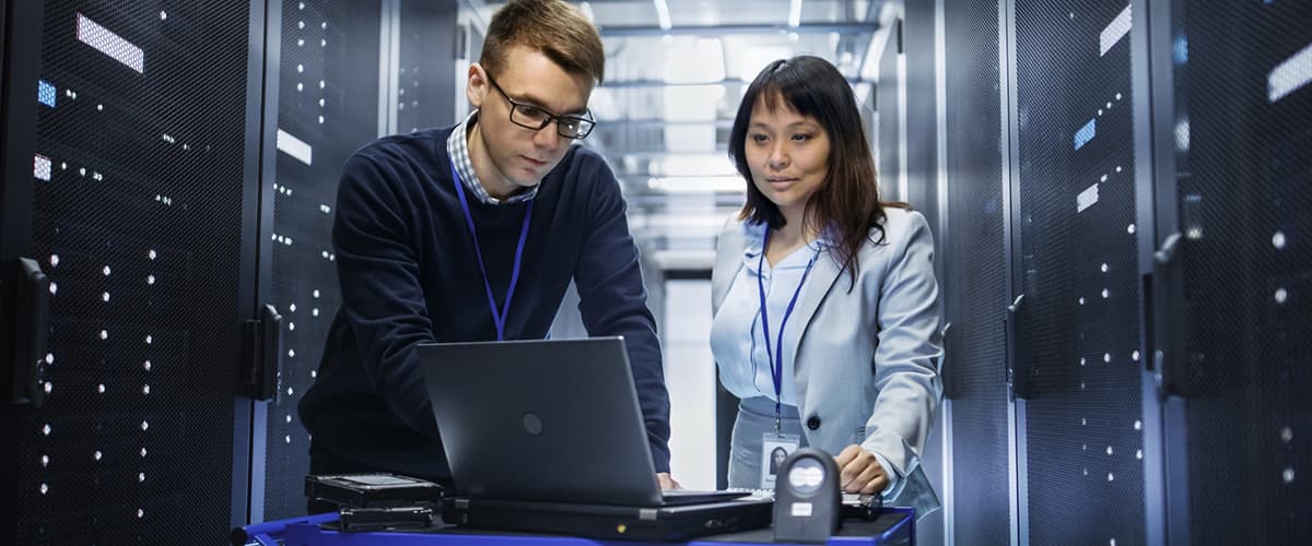 two people looking at computers