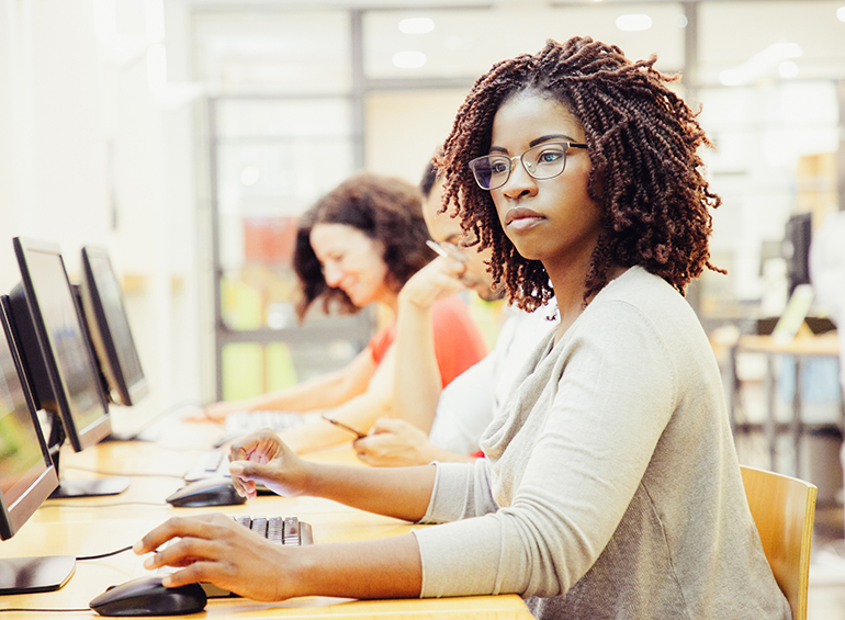 young female student at a computer