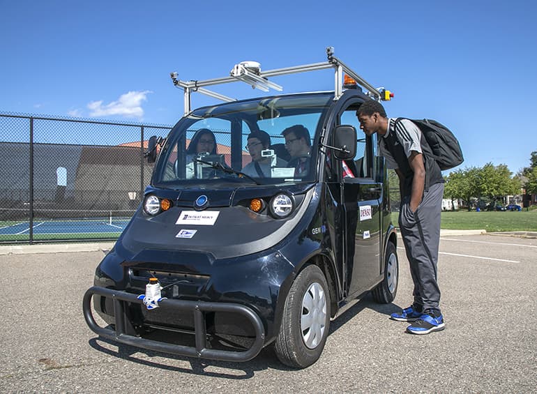 autonomous vehicle team outside