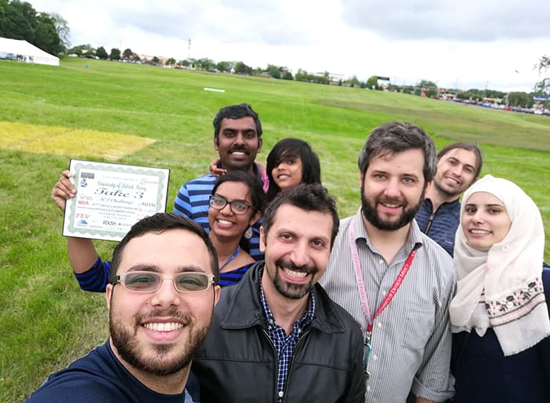 professors and students at a competition