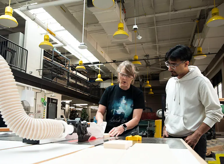 prof and student at mechanical engineering tool