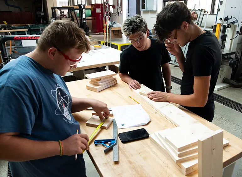 students wood-working in engineering annex