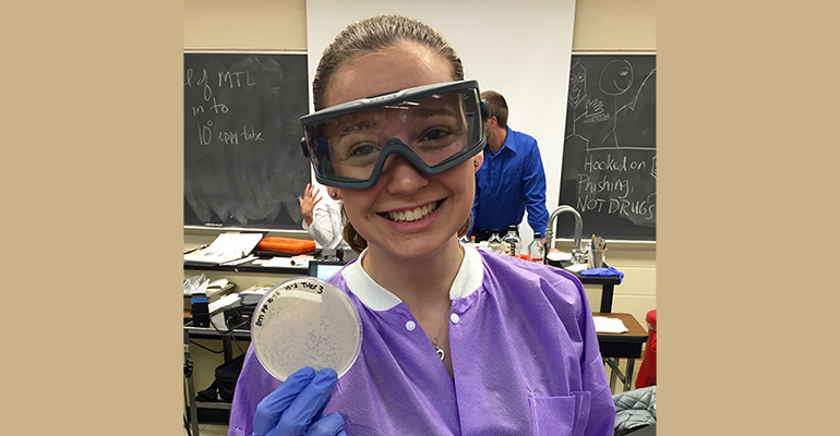 Maxwell with petri dish in science lab