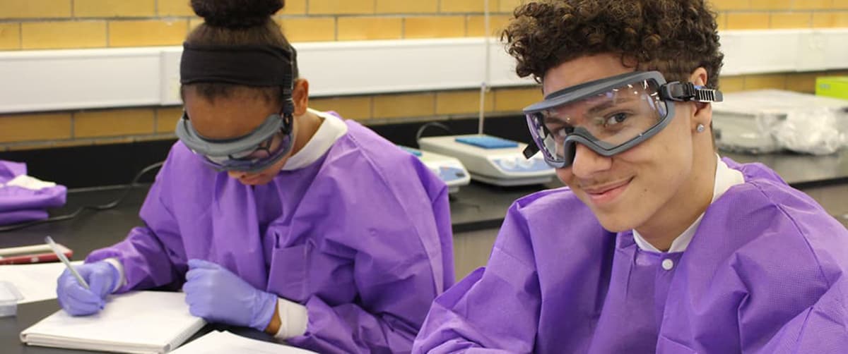 Two bio students at a desk