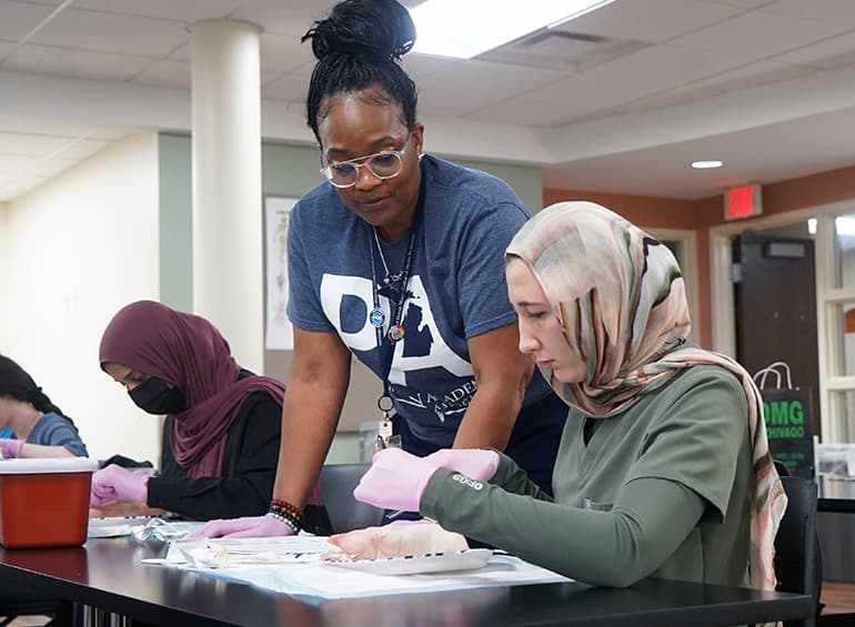 PA students practice suturing