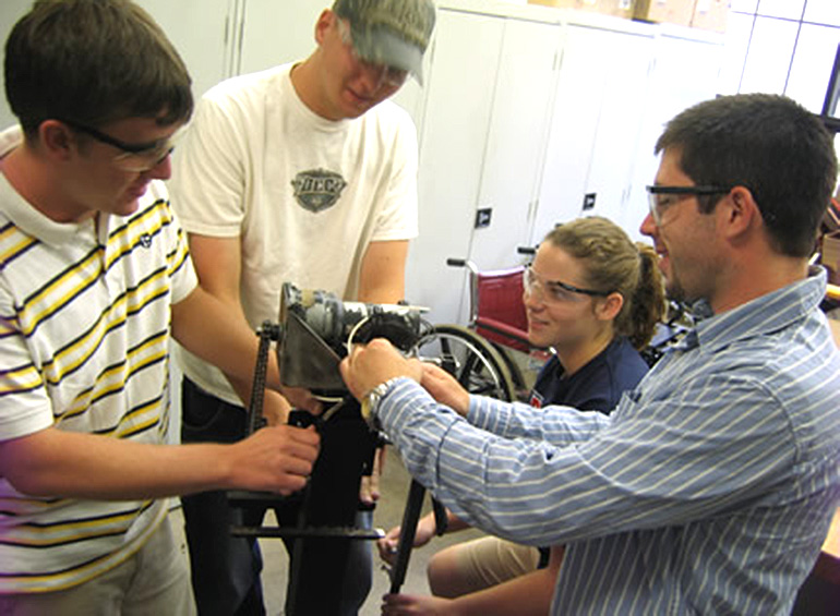 team working with client on new assistive device