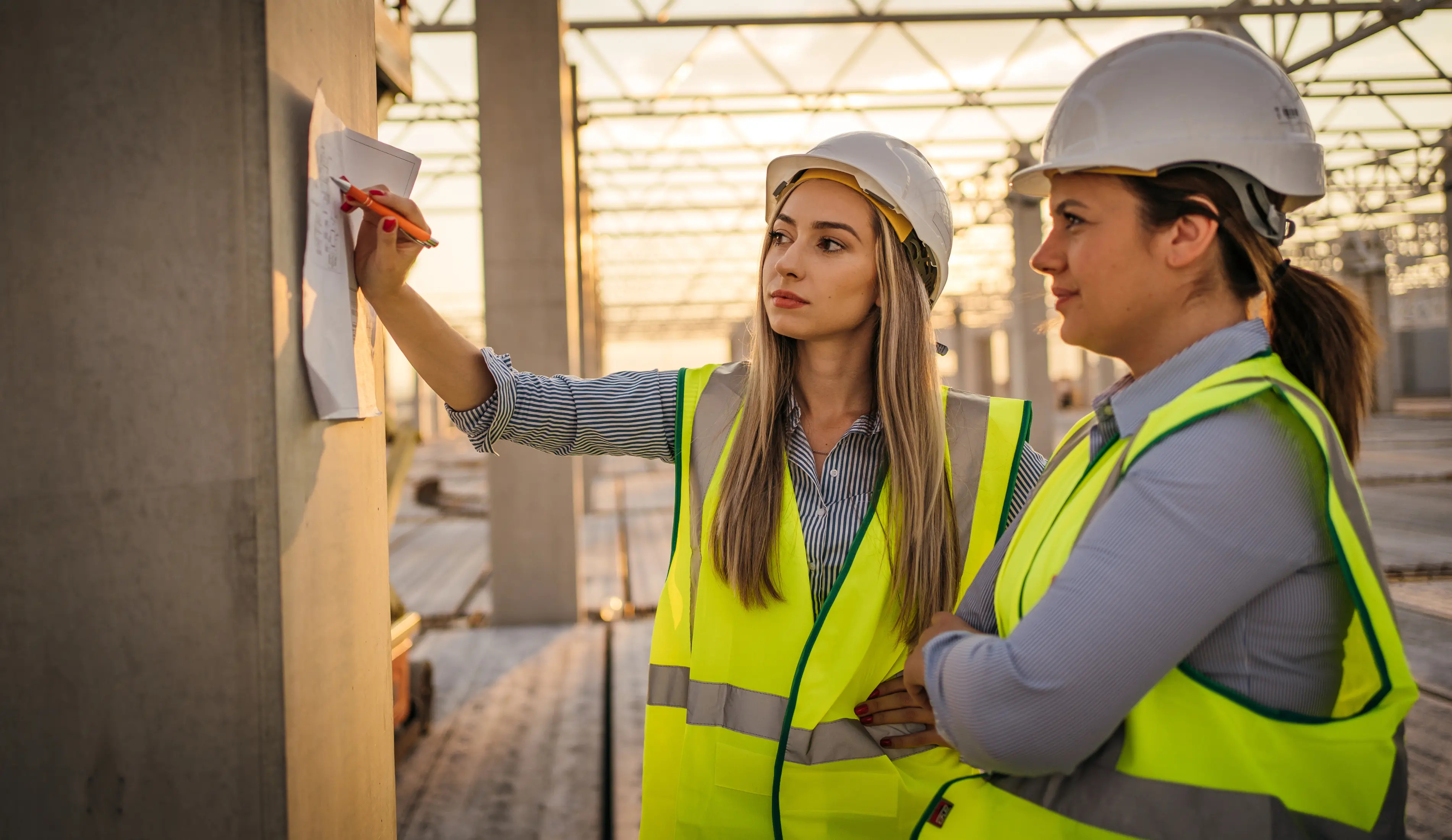 Female civil engineers working on a construction site.